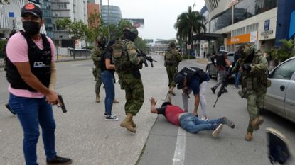 Ecuadorian police arrest several armed men who broke into the set of a public television channel after Ecuador president declares 'internal armed conflict'