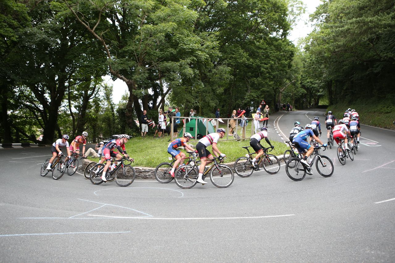 The pack rounds a corner at the British national championship road race.