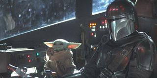 Din Djarin and Baby Yoda traveling through the galaxy