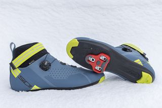 A pair of blue Sidi Nix shoes on the snow