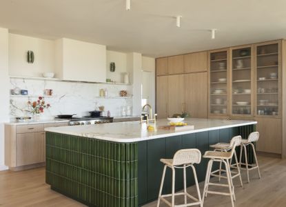 contemporary kitchen with large green island