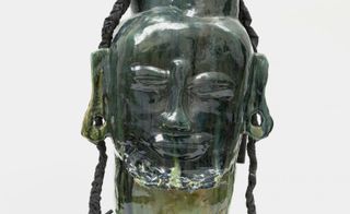 Green figure head glazed ceramic art piece