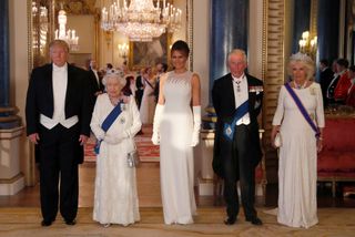 Donald Trump, Queen Elizabeth, Melania Trump, King Charles and Queen Camilla at a 2019 banquet in white tie attire