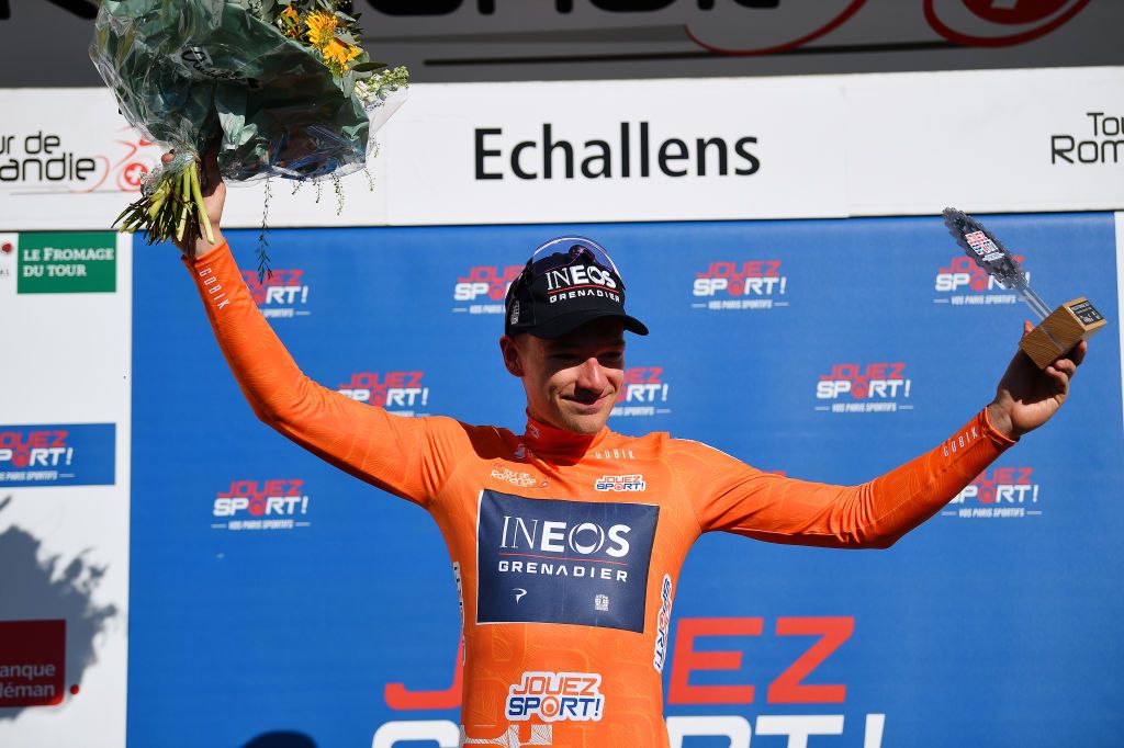 OULENSSOUSECHALLENS SWITZERLAND APRIL 28 Ethan Hayter of United Kingdom and Team INEOS Grenadiers celebrates winning the orange points jersey on the podium ceremony after the 75th Tour De Romandie 2022 Stage 2 a 1682km stage from challens to challens TDR2022 on April 28 2022 in OulenssousEchallens Switzerland Photo by Dario BelingheriGetty Images