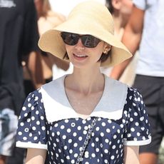 Lily Collins styled the mesh ballet flats trend in Greece on a day off from filming Emily in Paris Season 6
