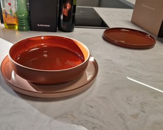 The Our Place Set the Table dinnerware set in Spice on marble worktop at Future Plc, Winnersh Triangle, Reading, United Kingdom test kitchen
