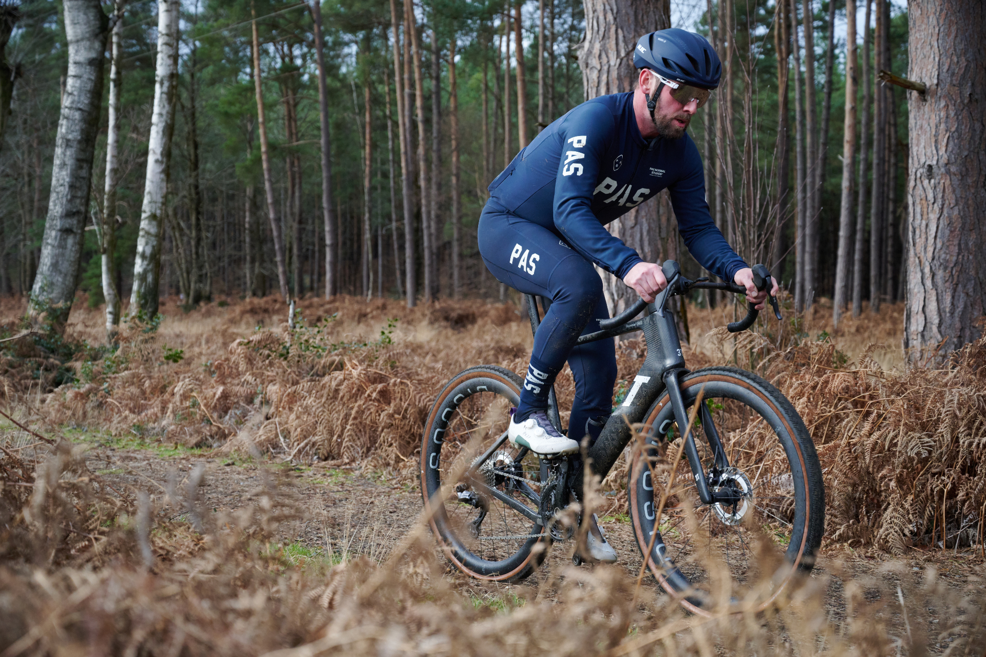 The author riding the 3T RaceMax Italia 2 gravel bike on forest trail