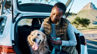 Woman on road trip with dog