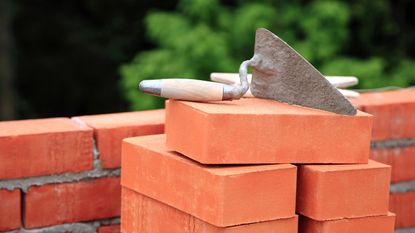 cement mix concrete is compacted sand by spade for construction Stock Photo  - Alamy