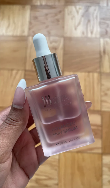 a person holding a hydrating skin serum