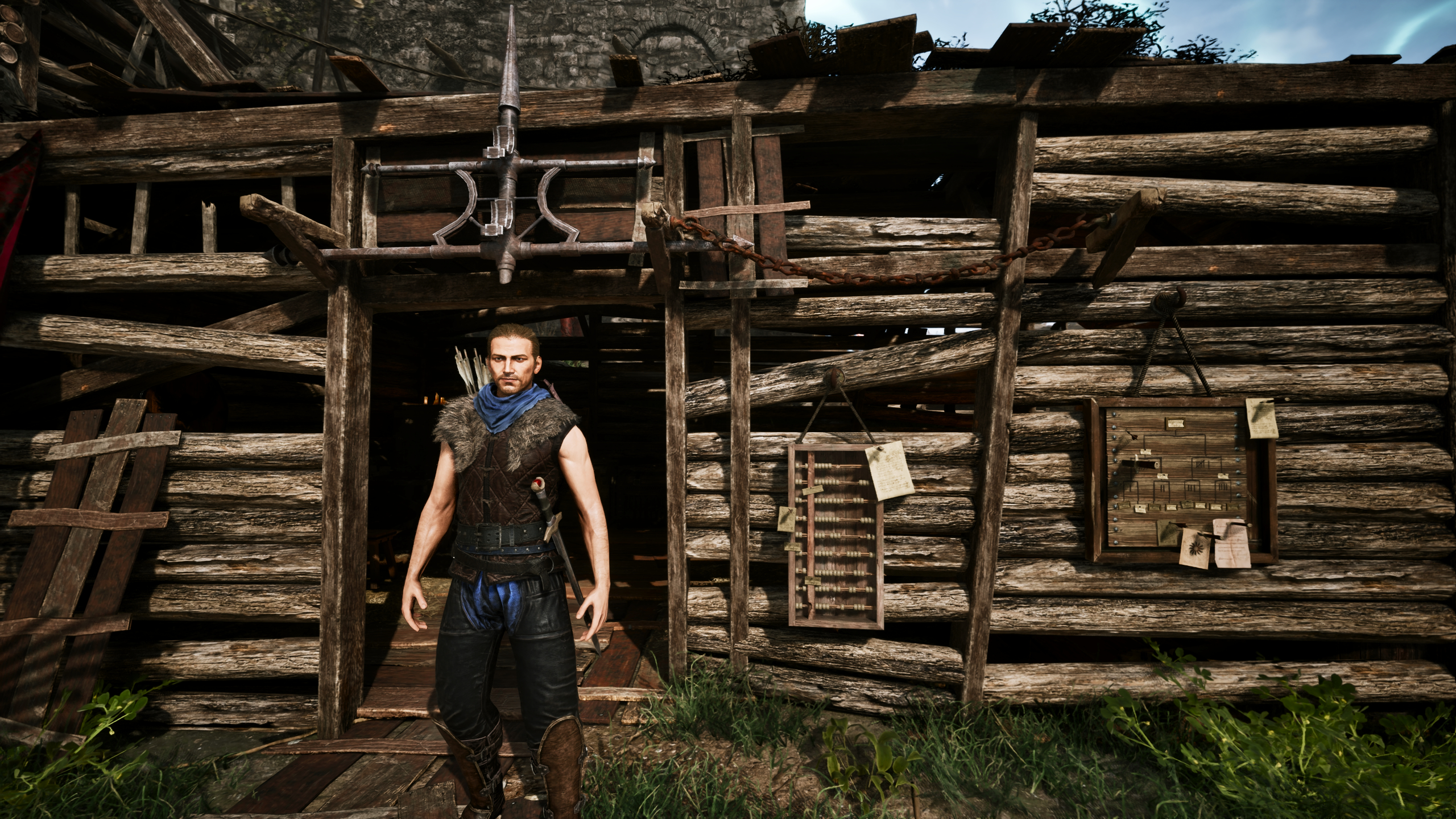 Gothic Remake Scatty's chest: A player stood outside Scatty's hut near the castle walls in the Old Camp, during the day, facing the camera.