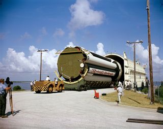 A stage of the uprated Saturn 1 launch vehicle mission unloaded from NASA barge Promise after arrival at Cape Kennedy. This launch vehicle was intended for Apollo/Saturn 204 mission (later renamed Apollo 1).