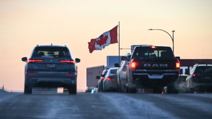 Cars line up to enter Canada