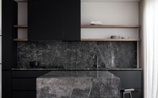 A kitchen with black granite countertop