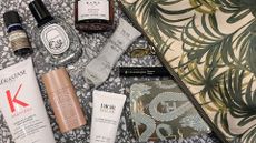 a wash bag with beauty products spilling out depicting the best items to travel with