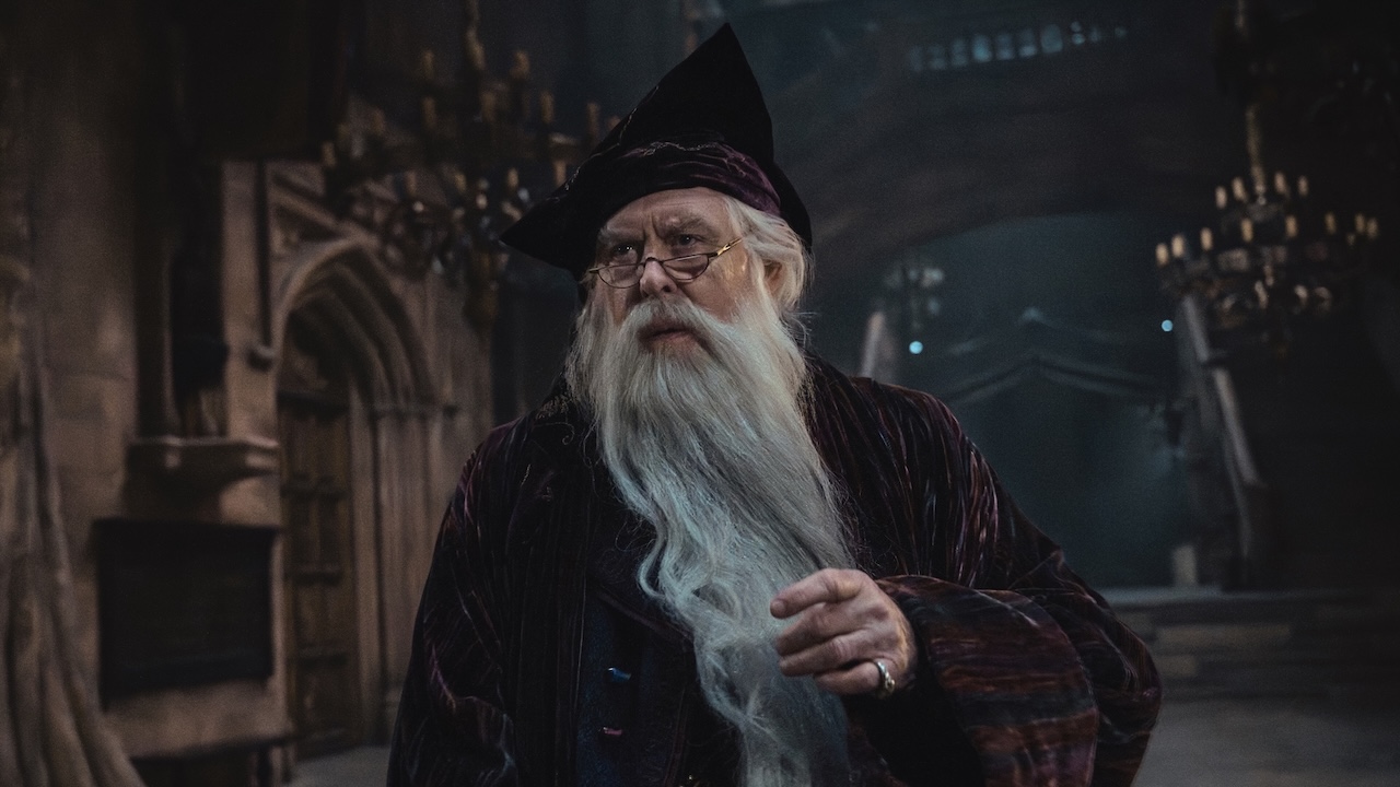 John Lithgow's Dumbledore with long grey beard in Harry Potter and the Philosopher's Stone