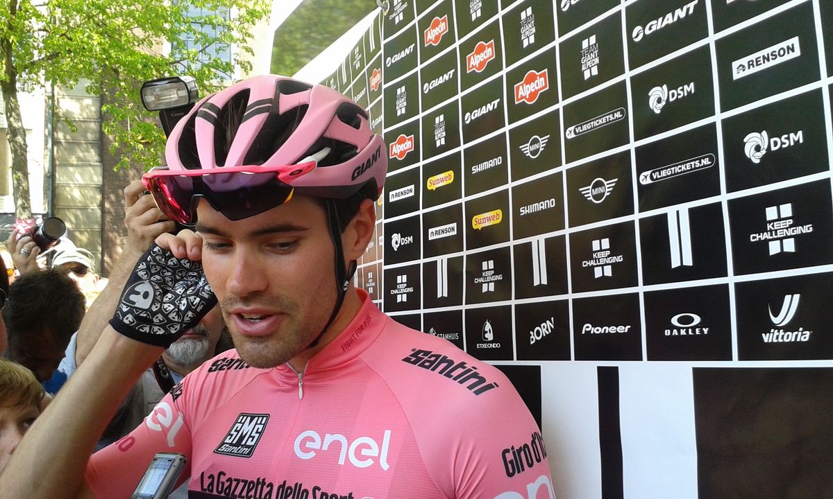 Tom Dumoulin emerges from the Giant-Alpecin bus decked out in pink