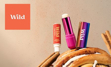 wild logo top left with three wild products sitting ontop of a cinnamon bun 