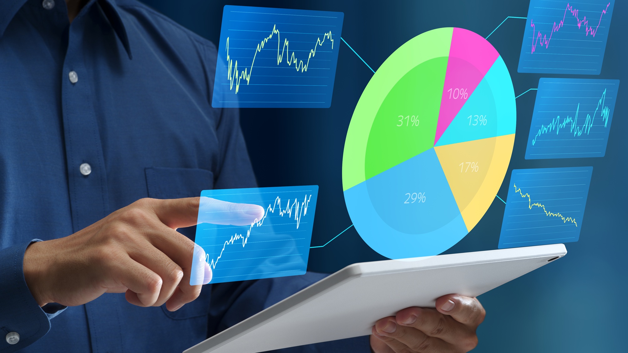 A man holds a tablet with financial charts and a pie chart floating above it.
