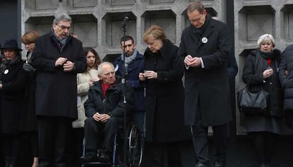 Angela Merkel attends a memorial to the victims of the 2016 terror attack