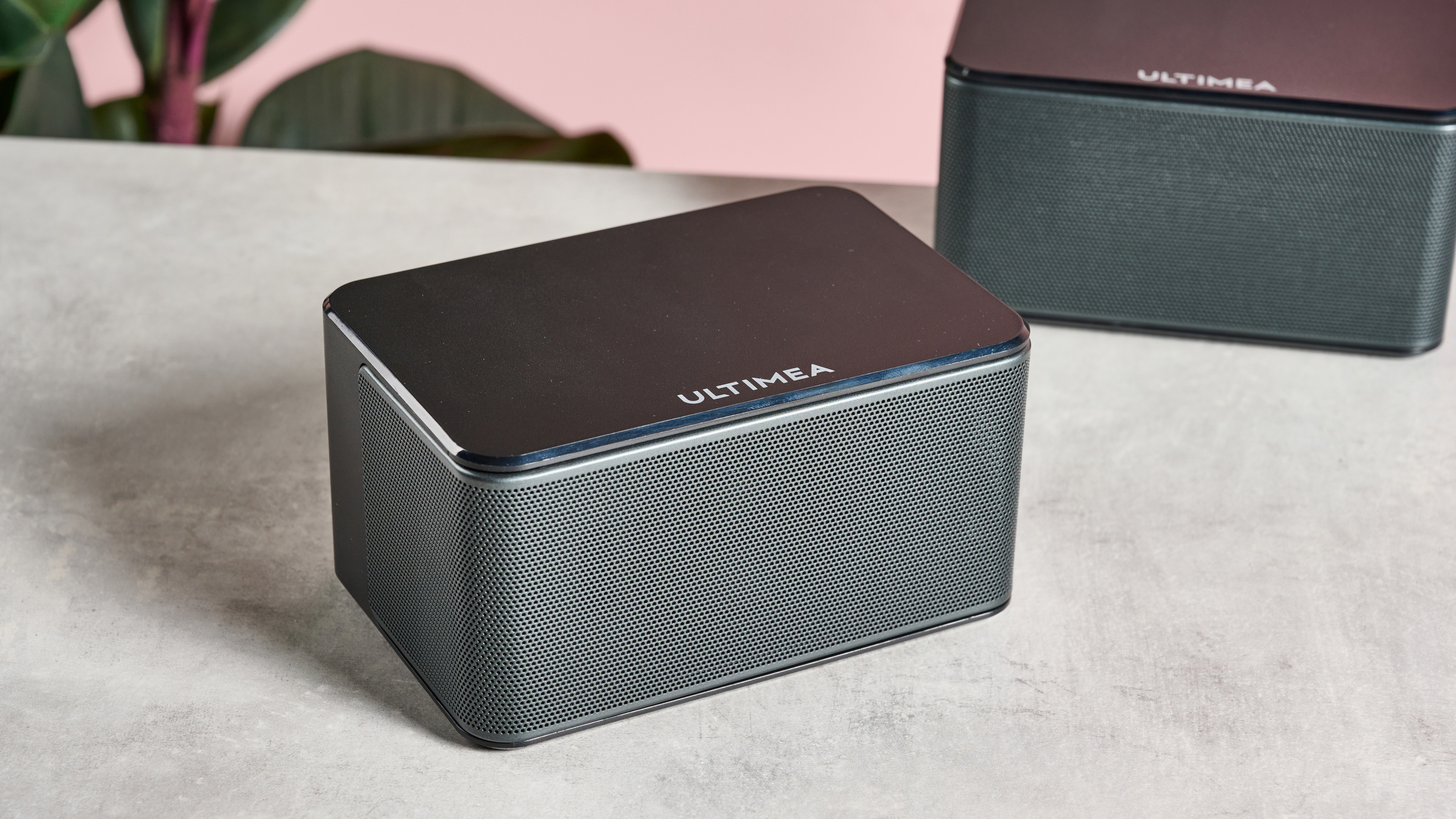 Ultimea Poseidon D60 rear speaker on table