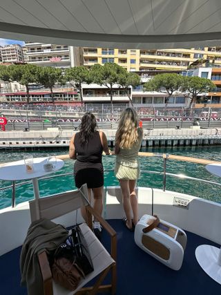 Eliza Huber and a friend watching qualifying at the Monaco Grand Prix from an Alpine F1 boat.