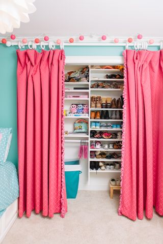 shoe storage, shelving space with pink curtains to hide, kids room