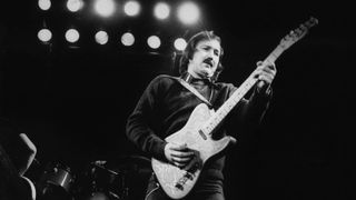James Burton performs live on stage with the Emmylou Harris Hot Band in Amsterdam, Netherlands in 1975