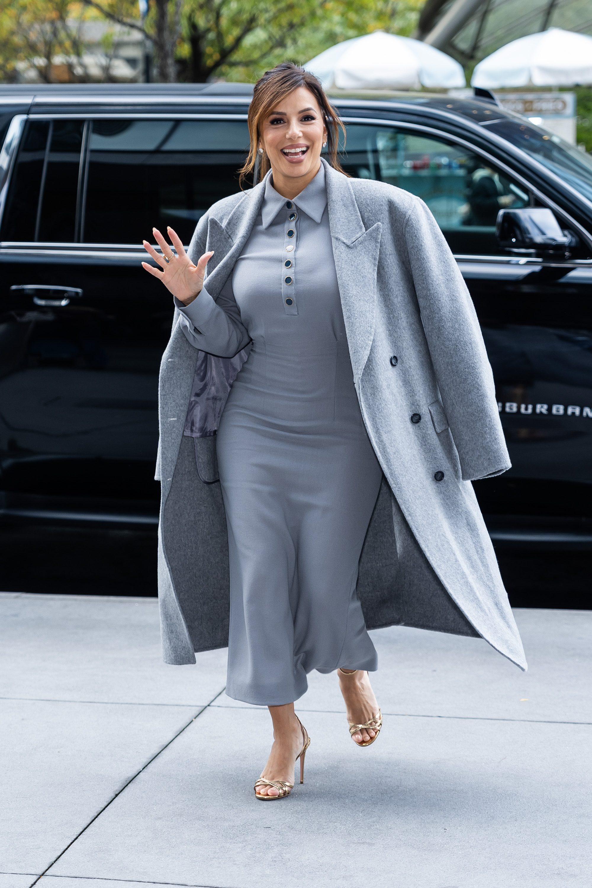 Eva Longoria wore a gray polo dress with a matching coat in 2024
