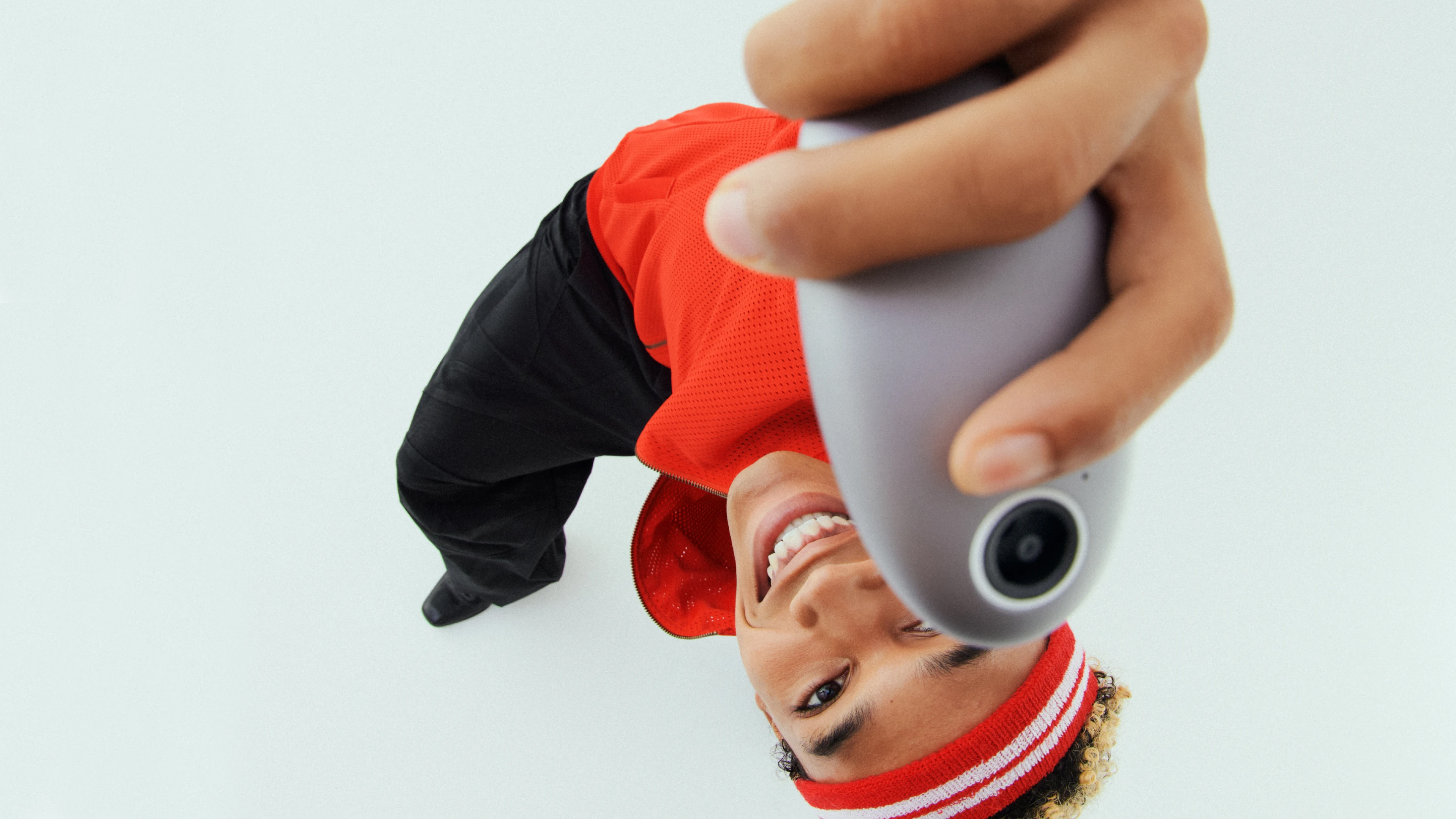 The Kyu camera held in a person's hand