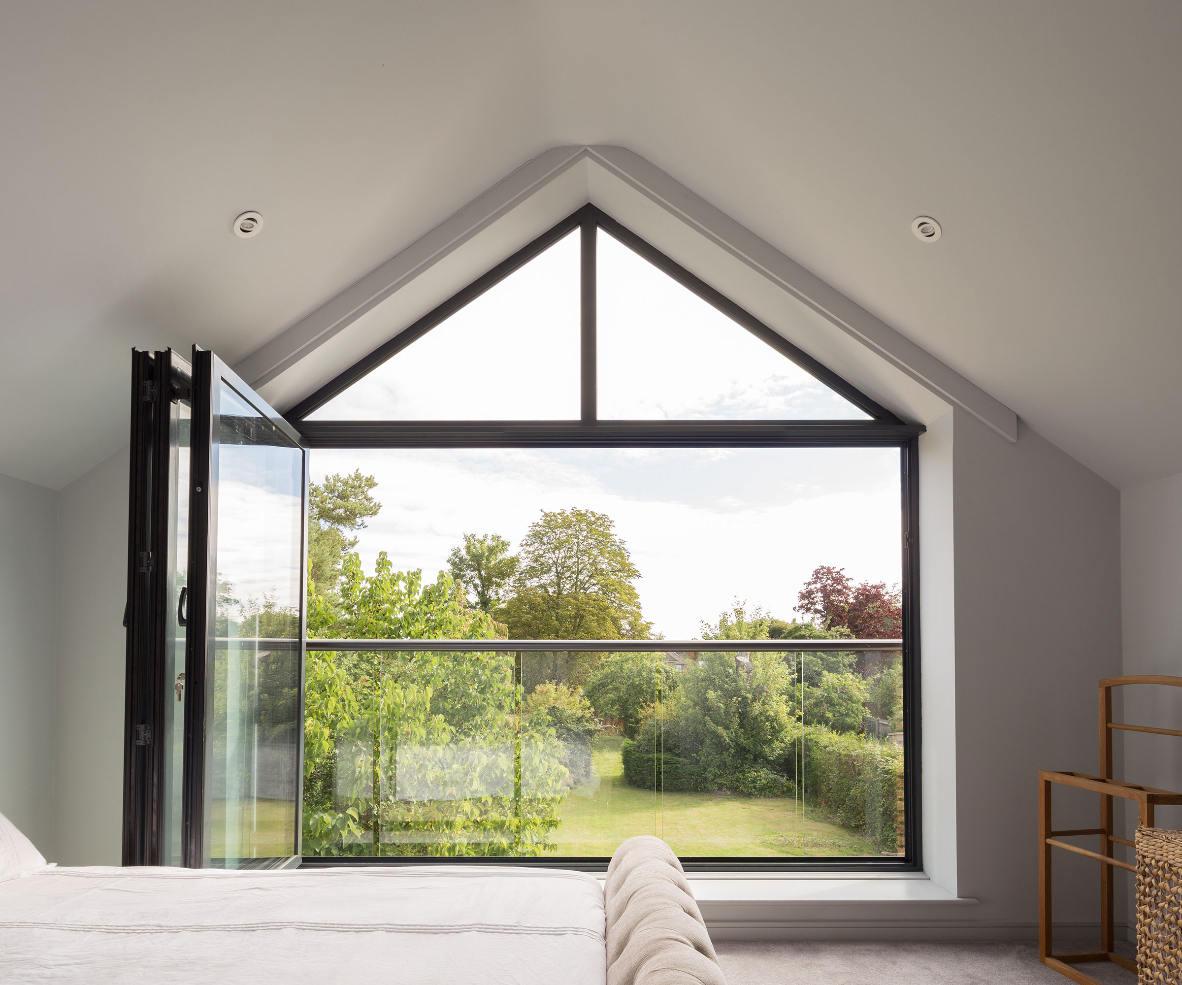 bedroom with bifold doors and Juliet balcony