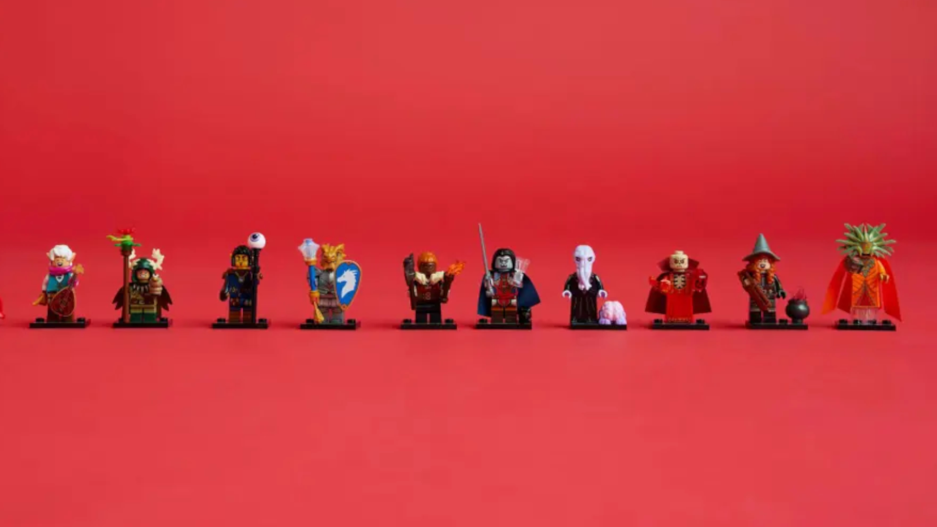 Lego DnD minifigures in a row, against a red background