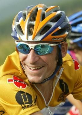Denis Menchov's a happy man to still be in yellow
