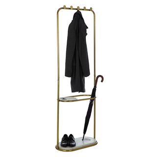 Boutique Hotel Coat Stand in a brass finish with a black coat hanging up, black shoes at the base and a black umbrella in the stand
