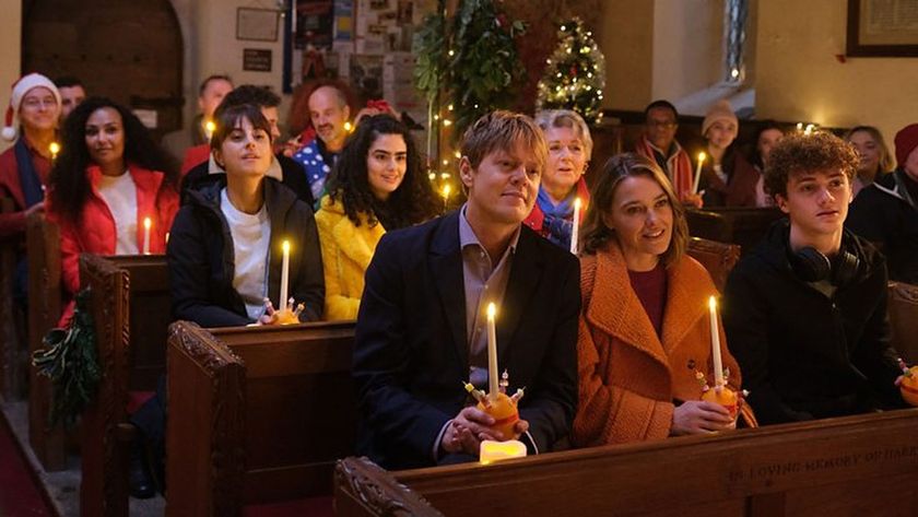 The cast of Beyond Paradise, including Kris Marshall as Detective Inspector Humphrey Goodman and Sally Bretton as Martha Lloyd sit for a church service in the Beyond Paradise 2024 Christmas Special 