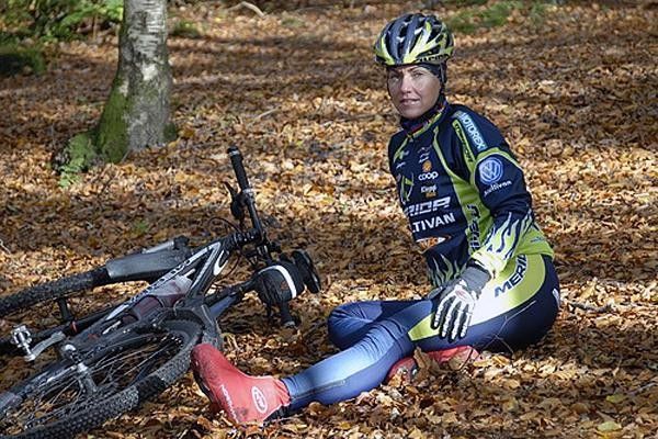 Gunn-Rita Dahle Flesj&aring; rests on a bed of freshly fallen leaves.