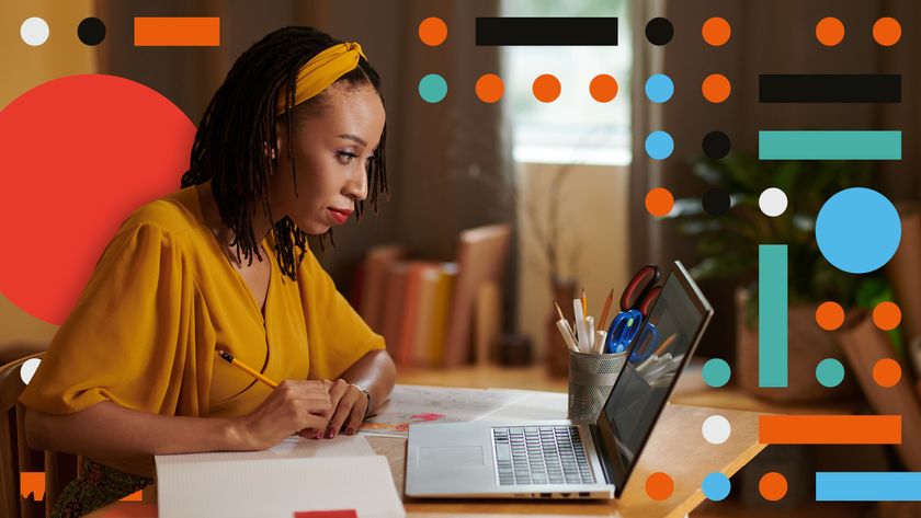 woman at a computer with dots around her