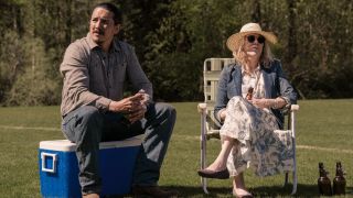 Tommy Miller (Gabriel Luna) and Gail (Catherine O'Hara) take in a baseball game on The Last of Us.