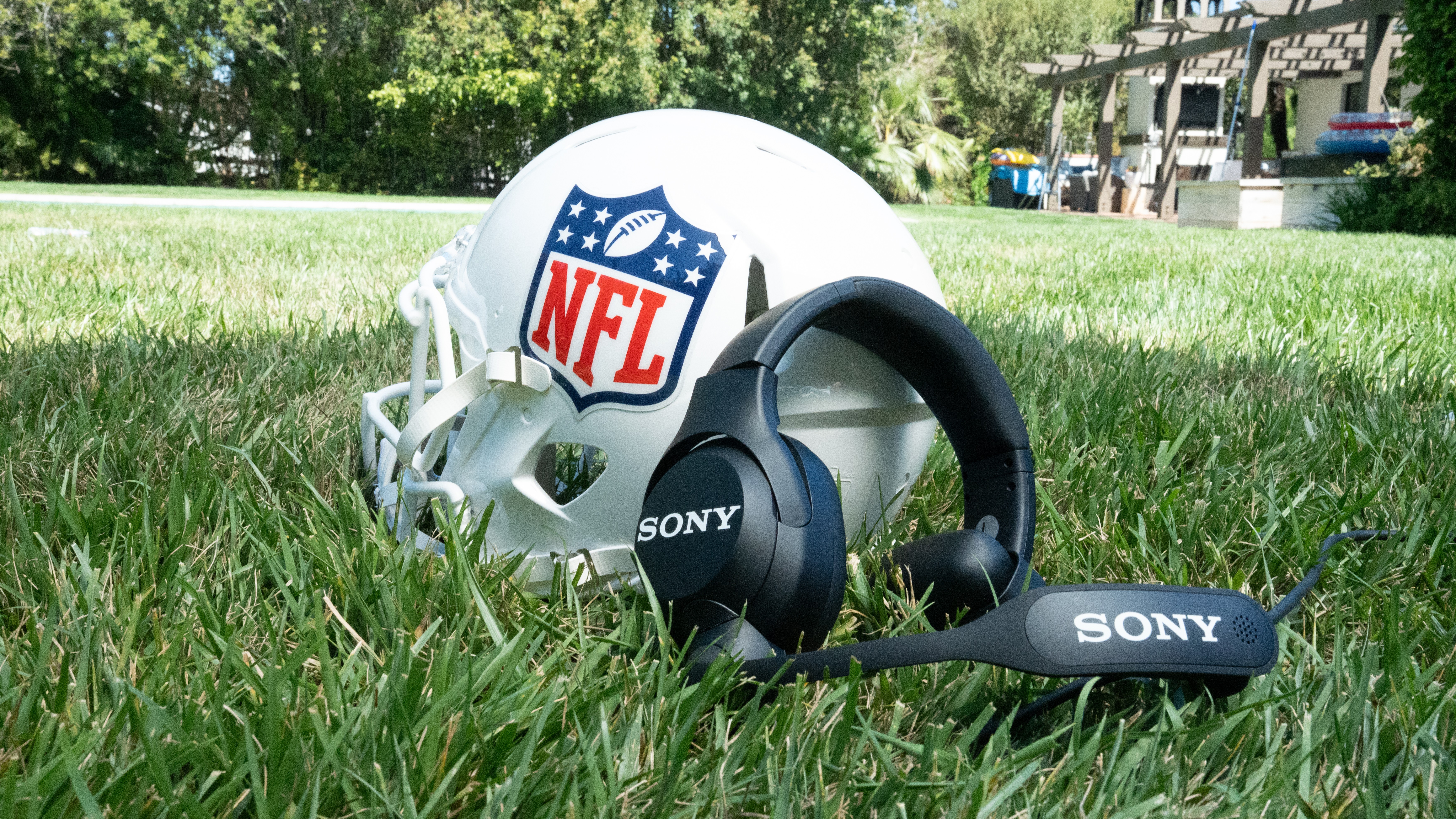 Sony headset next to an NFL headgear