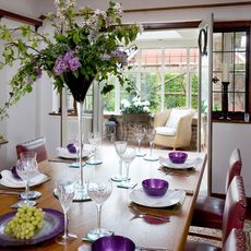 dining table with flowers and glassware
