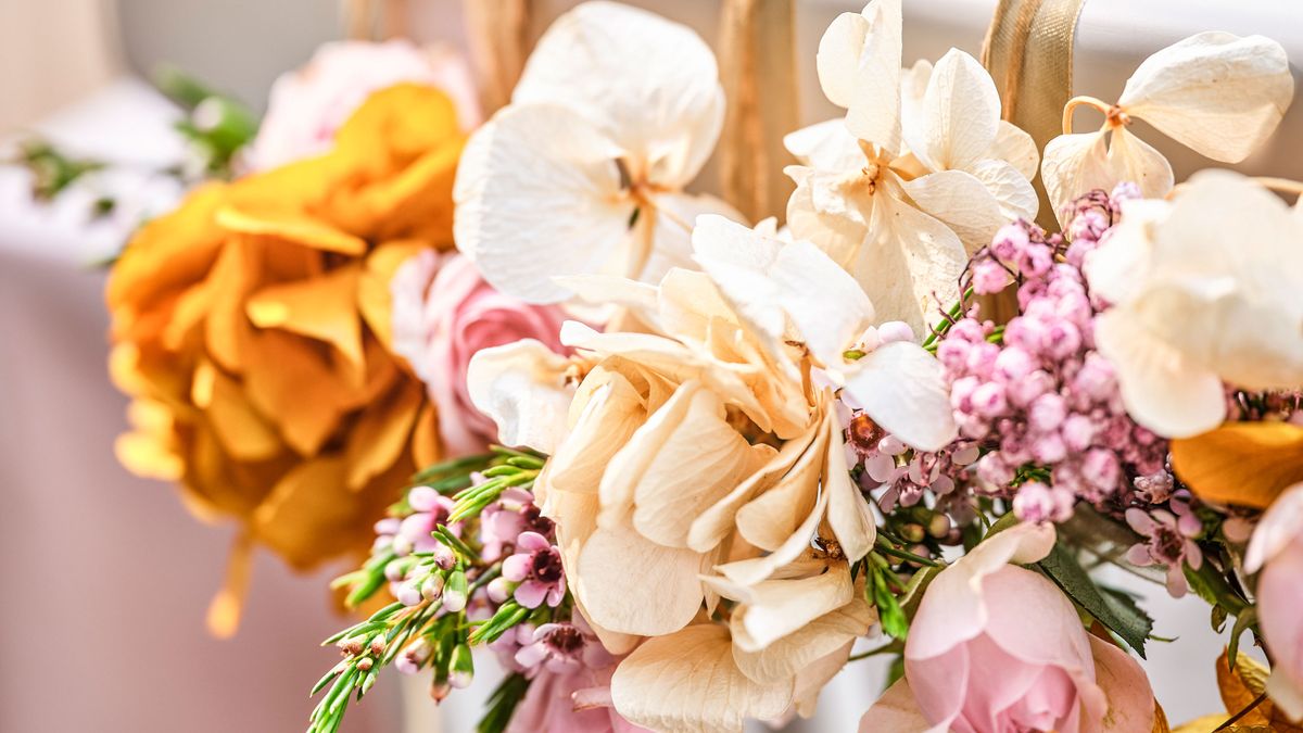 Cute way to hide hide artificial flower stems!  Table decorations,  Artificial flowers, Flowers