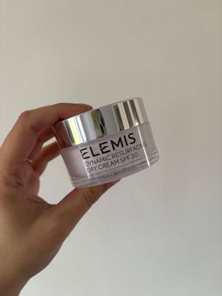 Mica Ricketts holding Elemis Dynamic Resurfacing Day Cream SPF30 