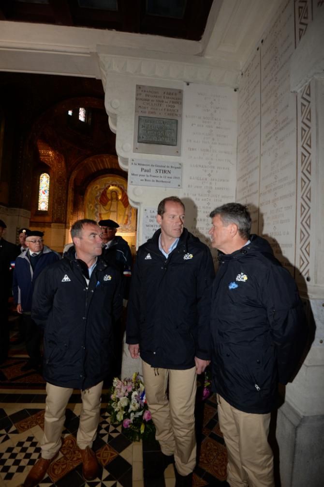 Christian Prudhomme and former Tour winners Bernard Hinault and Bernard Thevenet French at the memorial site at Notre-Dame-de-Lorette near Arras