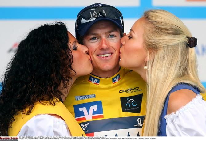 Mathias Frank (IAM Cycling) wears the leader's jersey after stage 2