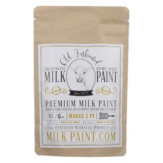 A sachet of Old Fashioned Milk Paint powder with a plain blackground