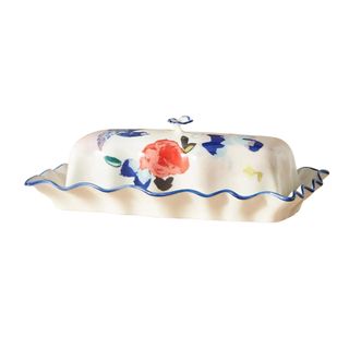 A wavy ceramic painted floral butter dish