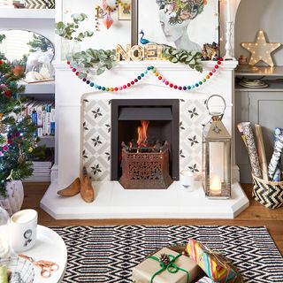 Quirky Christmas living room with decorated fireplace and patterned rug