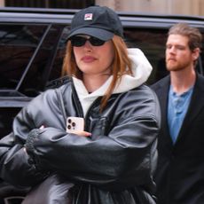 Hailey Bieber wears Fila Echappe metallic sneakers with athleisure.