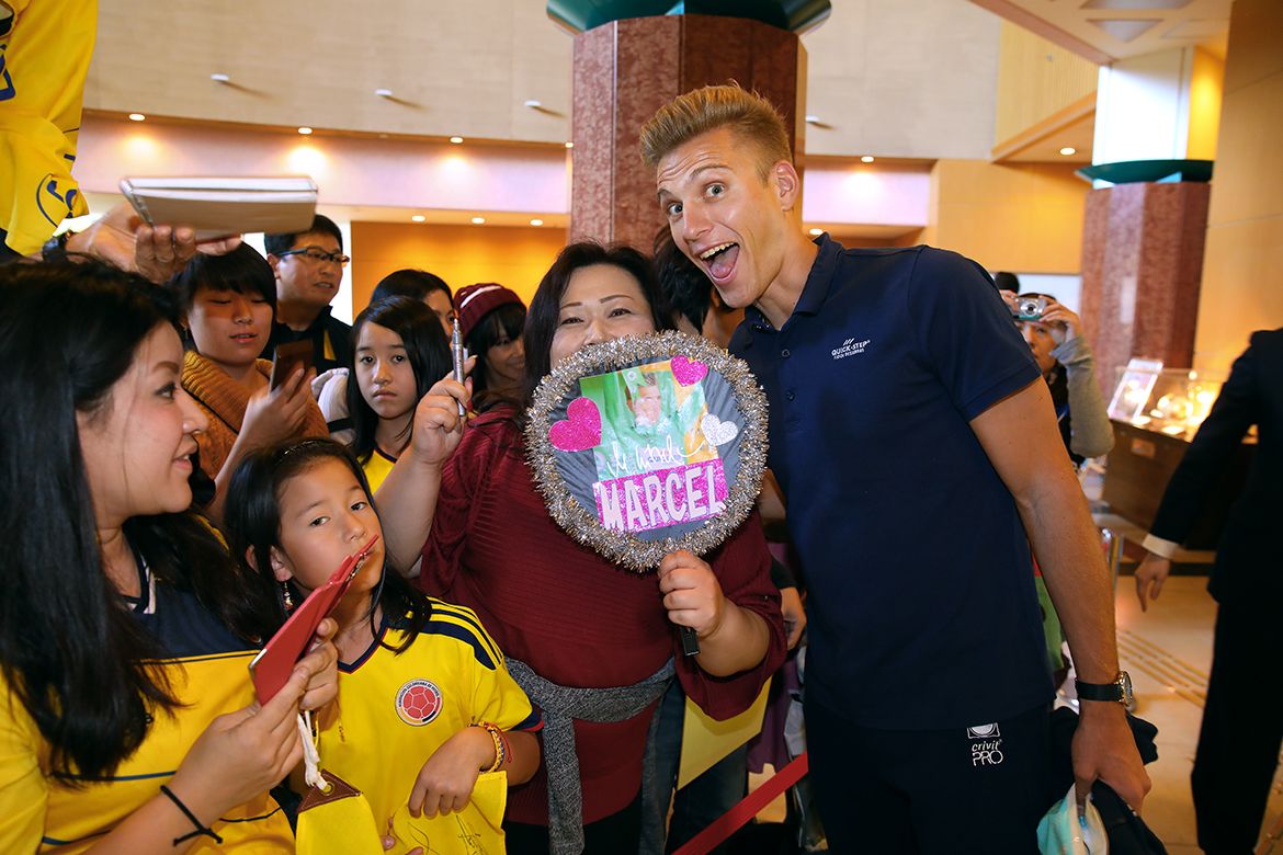 Marcel Kittel poses for a photo with a fan