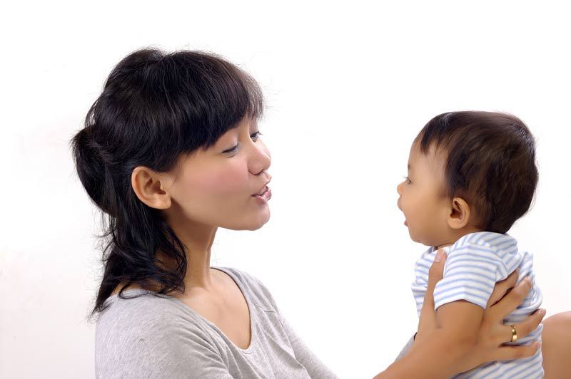 mother talking to baby